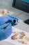 Closeup of archaeologist working in natural research lab. Laboratory assistant cleaning animal bones. Close-up of hands