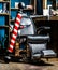 Closeup armchair. Barber shop pole. Logo of the barbershop, symbol. Stylish vintage barber chair. Barbershop armchair