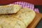 Closeup Aromatic Rosemary Focaccia Bread Slices on Wooden Breadboard
