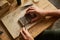 Closeup of artisan jeweler holding handmade ring