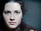 Closeup Artistic Portrait of Caucasian Woman Looking Through Woman Looking Through Glass with Water Drops and Tears