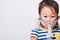 Closeup Asian face, Little baby girl sick her using steam inhaler nebulizer mask inhalation oneself