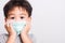 Closeup Asian face, Little children boy sick he using medicine healthcare mask