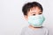 Closeup Asian face, Little children boy sick he using medicine healthcare mask