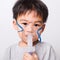 Closeup Asian face, Little children boy sick he using steam inhaler nebulizer mask inhalation oneself