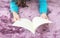 Closeup asian woman lied on purple carpet at floor in the house textured background for read a book in relax time , free time at h