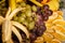 closeup assortment of sliced tropical fruits on big plate