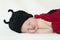 Closeup of baby with ladybug knit hat and bodice