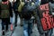 Closeup of the Back of a protester Wearing a Sign