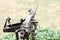 Closeup and back view of M2 .50cal Browning machine gun with tripod standing in bunker