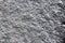 Closeup background of casting metal steel texture macro. Gray cast iron galvanized silver surface. Concept of lifeless