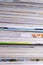 Closeup background of a pile of magazines