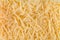 Closeup background texture grated cheese