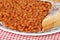 Closeup baked beans in tomato sauce with toast