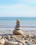 A Closeup of a Balanced Pile of Rocks on a Beach