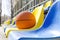Closeup of ball on the school stadium seats.Concept of basketball competition at the local sport court