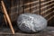 Closeup of a ball of wool in the wooden barn in the countryside