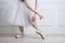 Closeup ballet dancer`s legs in pointes and hands