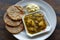 Closeup of Banarasi Aloo sabzi and Kachori with Dahi Mattha Kalyan