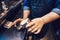 Closeup of barista hands making cold iced coffee cappuccino latte.