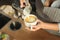 Closeup of barmen pouring milk to cappuccino cup