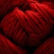 Closeup of a basket of red yarn rolls