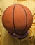 Closeup of basketball. Sportsman holding basketball.Vertical shot