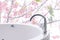 Closeup bathtub on cherry blossom background