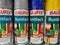 Closeup of baufix coloured varnish paint cans in shelf of german supermarket