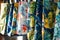 closeup of beach bags with tropical prints hanging