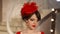 Closeup of beautiful fashion young girl in retro hat and red dress, brunette model with red lips makeup, elegant
