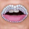 Closeup of beautiful pink lips with white gems and white teeth. Pink matt lipstick. Make-up, Cosmetics, lips art