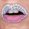 Closeup of beautiful pink lips with white gems and white teeth. Pink matt lipstick. Make-up, Cosmetics, lips art