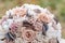 Closeup of beautiful pink rose bouquet held by a gracious bride