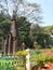 Closeup of beautiful tall wooden art in front of the Chama Raja Wadiyar statue at Cubbon Park