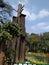 Closeup of beautiful tall wooden art in front of the Chama Raja Wadiyar statue at Cubbon Park