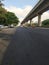 Closeup of Beautiful Wide Bangalore Asphalt Road with Namma Metro Bridge or Flyover in a side near the Goraguntepalya. Due to