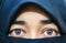 Closeup of beautiful woman face covered with hijab. Perfect shiny eyes of a Muslim girl. Young niqab girl portrait.