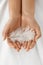 Closeup Of Beautiful Woman Hands Holding White Feather