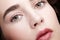 Closeup beauty macro face portrait of young woman. Brunette girl