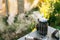 Closeup of bee smoker blowing smoke in wind against background of green grass