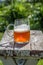 Closeup of a beer mug on old wood table top in sunlight