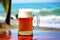 Closeup Beer Mug With Tropical Summer Blur Beach Background, Generative AI