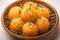 Closeup Besan Peda, a sweet treat enriched with ghee.