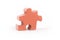 Closeup of big orange jigsaw puzzle piece