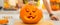 Closeup on big pumpkin Jack-O-Lantern with candle inside