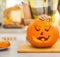 Closeup on big pumpkin Jack-O-Lantern with candle inside