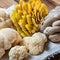 Closeup of Big raw mushrooms on a cloth displayed on a wooden table