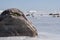 Closeup of big stone in Gulf of Riga covered with ice