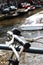 Closeup of bike handles with tour boat passing behind.